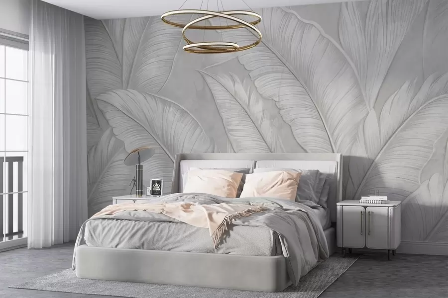 wall murals Highly-textured detailed large tropical leaves in a monochromatic light gray color in loft style w08772