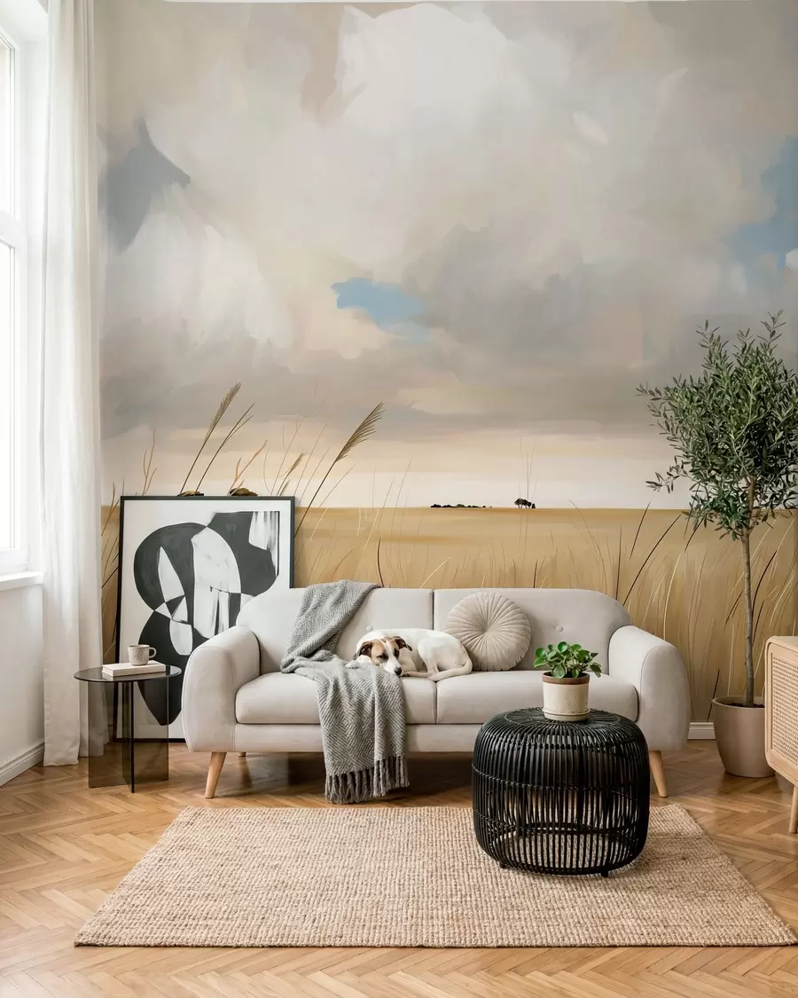 wall murals A panoramic view of a vast yellow field of grass beneath a cloudy sky w10079