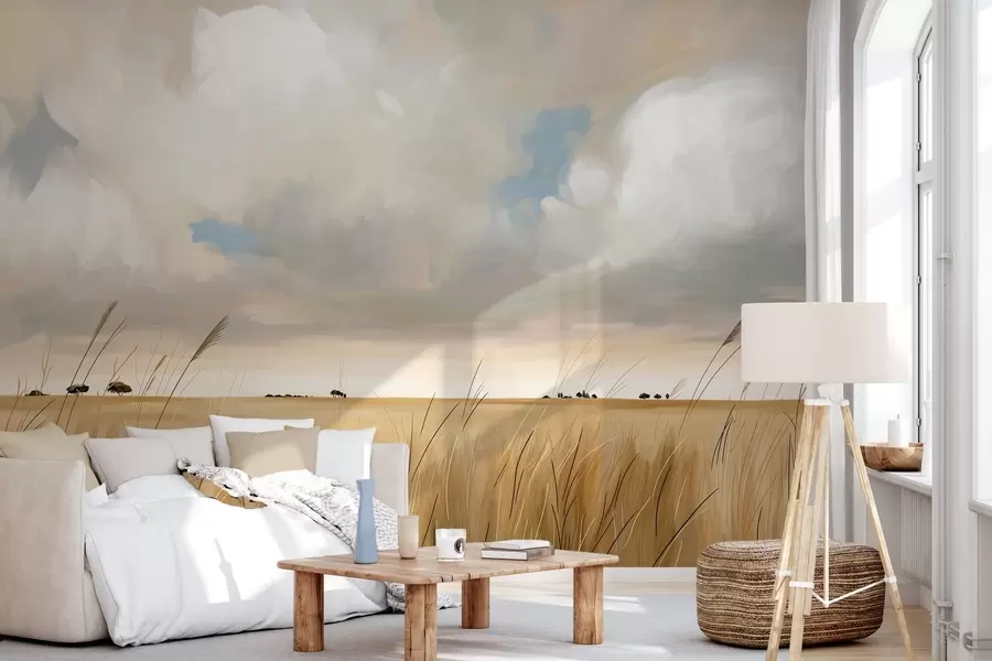 wall murals A panoramic view of a vast yellow field of grass beneath a cloudy sky w10079
