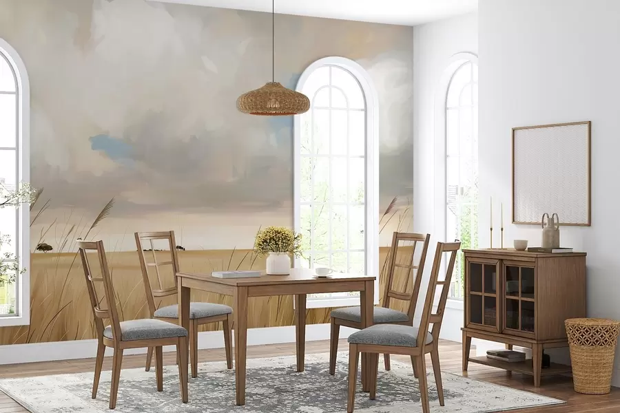 wall murals A panoramic view of a vast yellow field of grass beneath a cloudy sky w10079